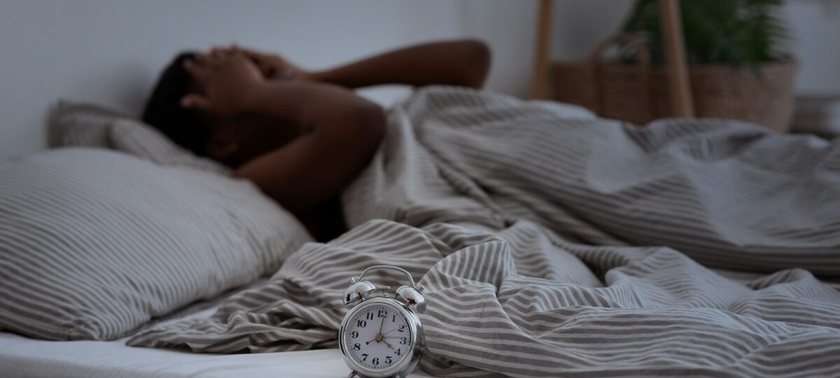 Understanding sleep apnea. Woman struggles to sleep.